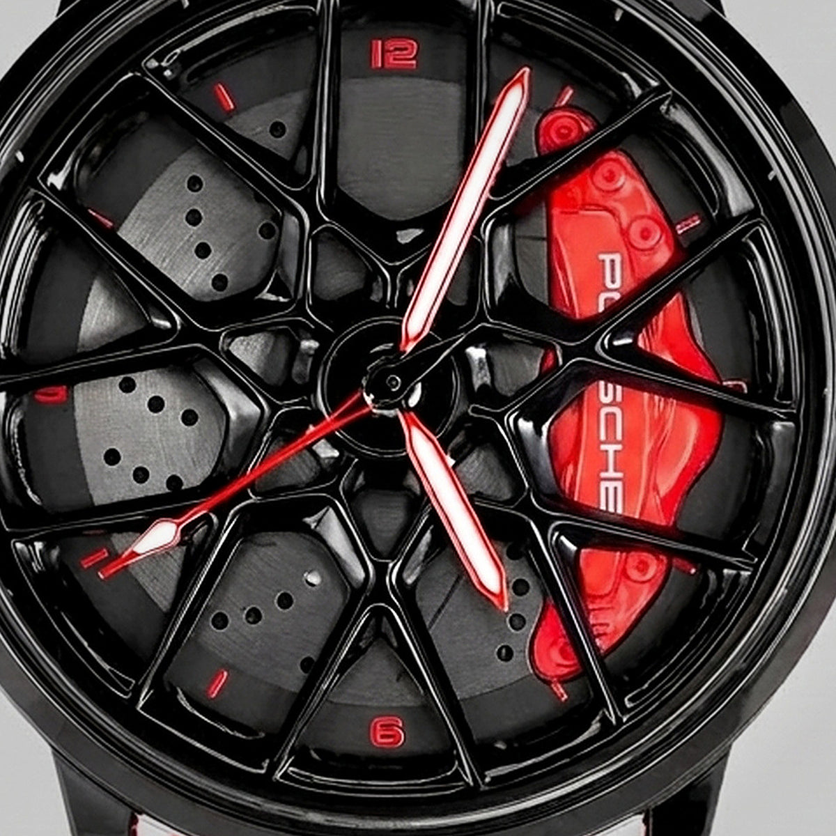 Primo piano del cerchio e della pinza incisa PORSCHE, orologio Porsche 718