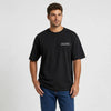 T-shirt Volkswagen Beetle Baja Bug Desert Misfit noir vu de face en plan rapproché avec logo Tourismo